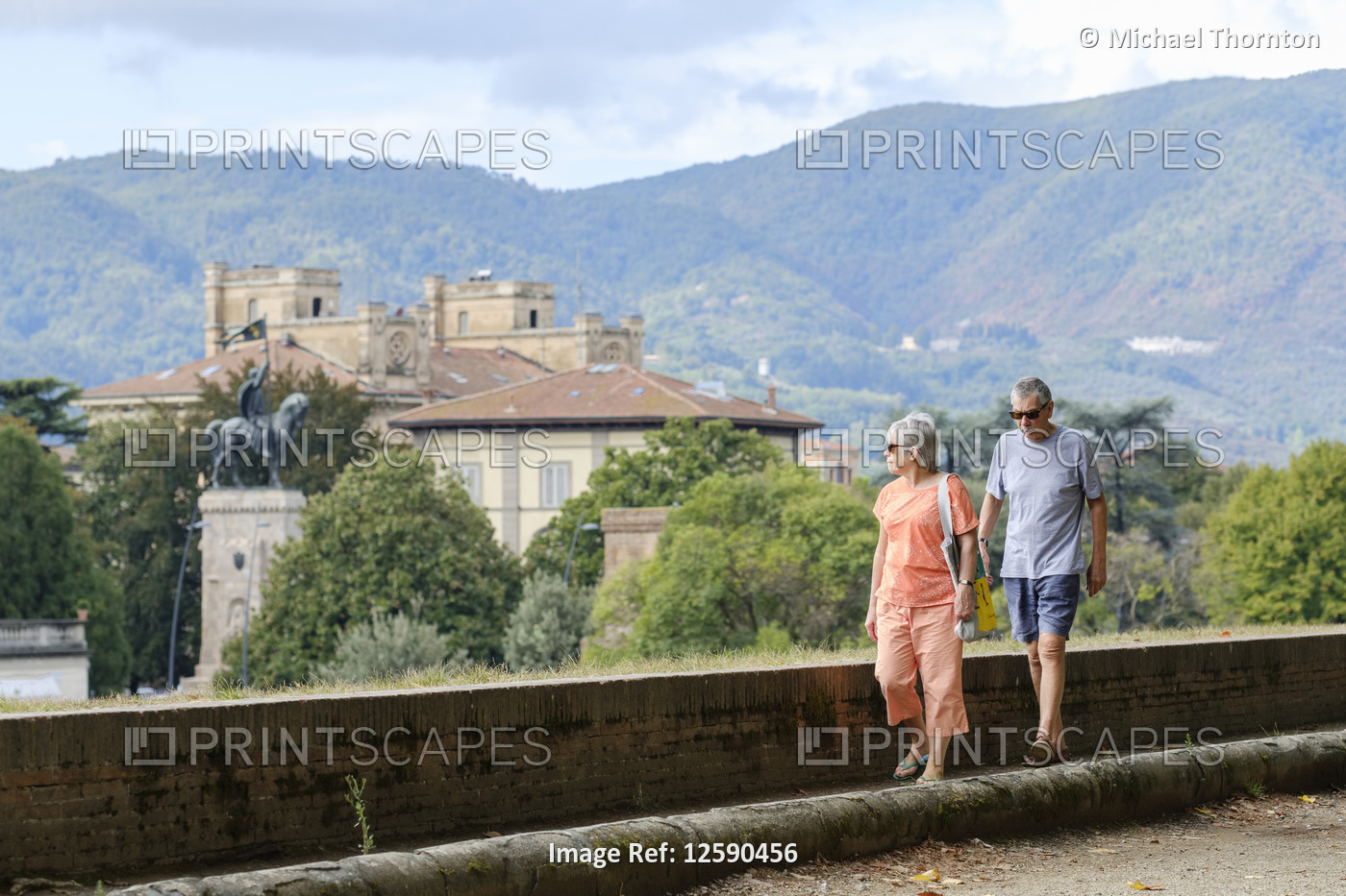 Tourists walking the ancient city wall of Lucca, Lucca, Tuscany, Italy, Europe,