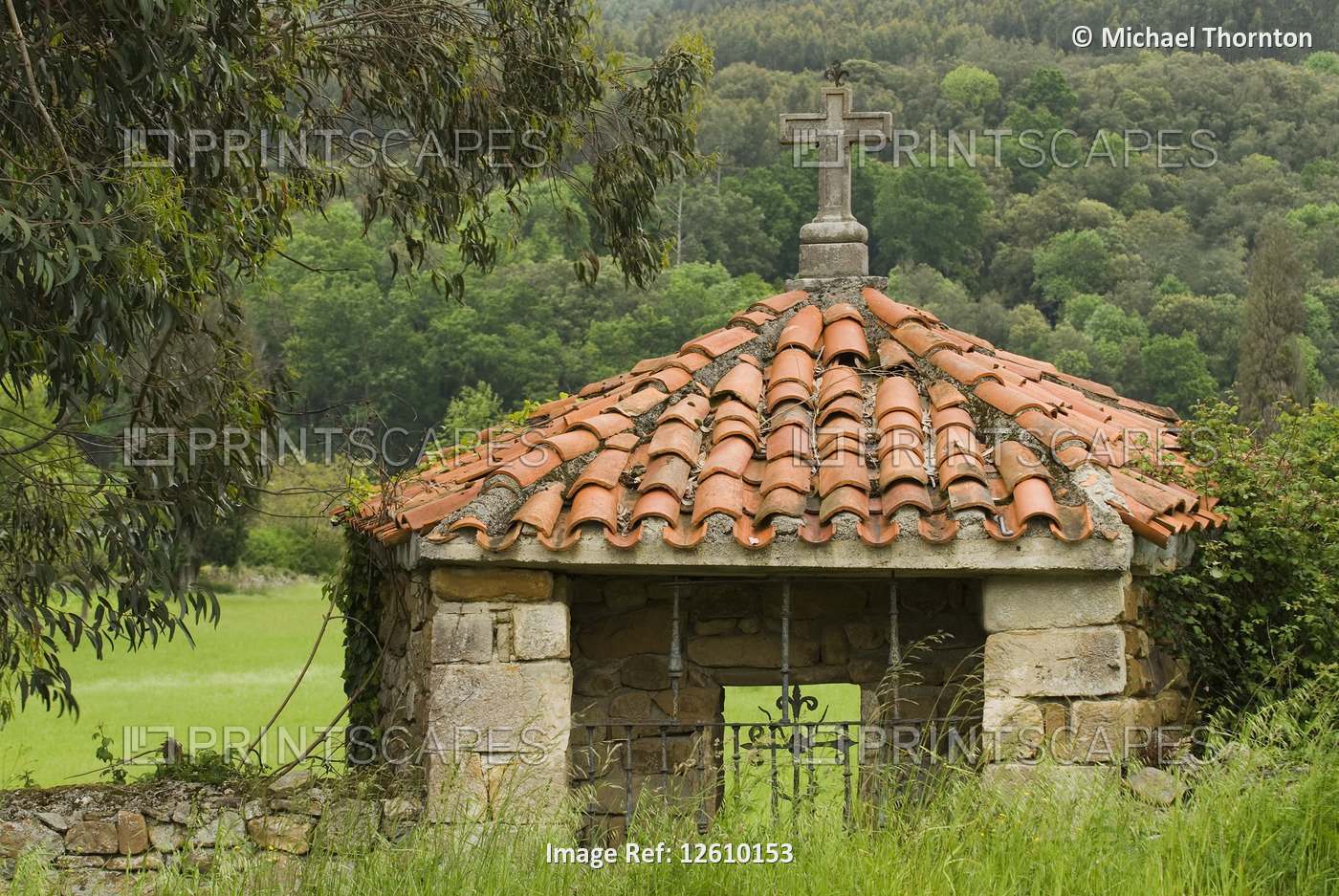 Pantiled Roof Shrine with Stone Cross in Rioseco, Northern Spain.