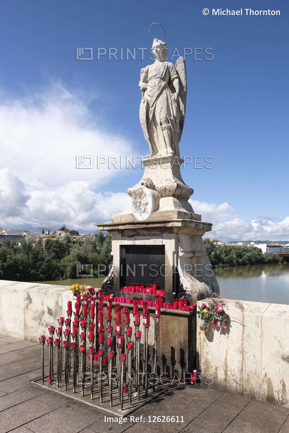 Statue of Archangel San Rafael c1651 on the Puente Romano, Roman Bridge over ...