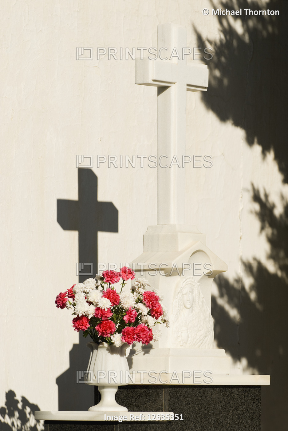 Grave with flowers and holy cross in Cemetry, Andalucia, Spain
