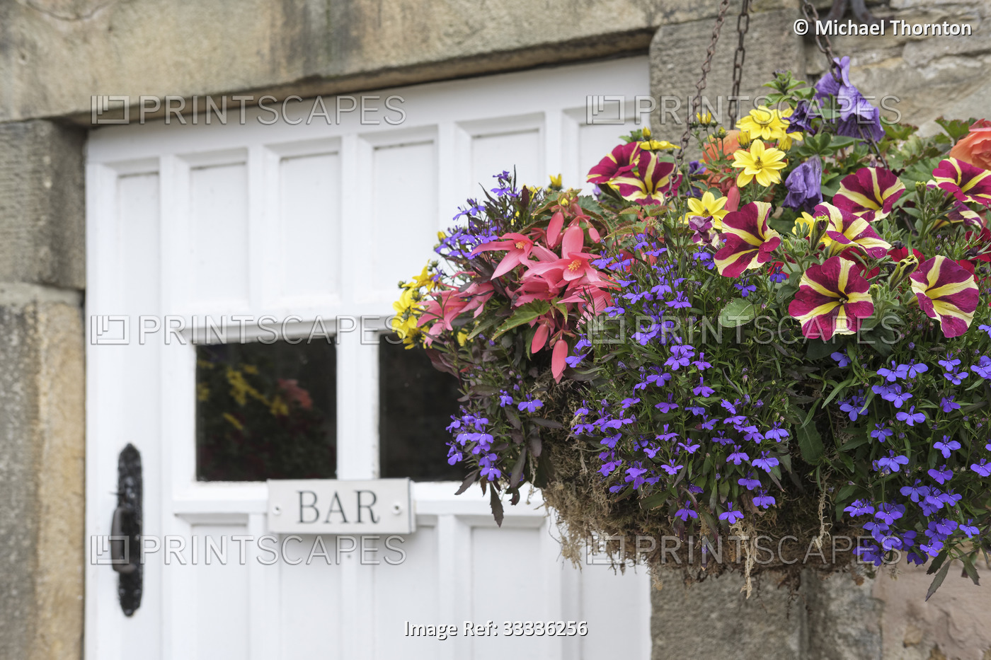 Bar entrance door with hanging flower basket.