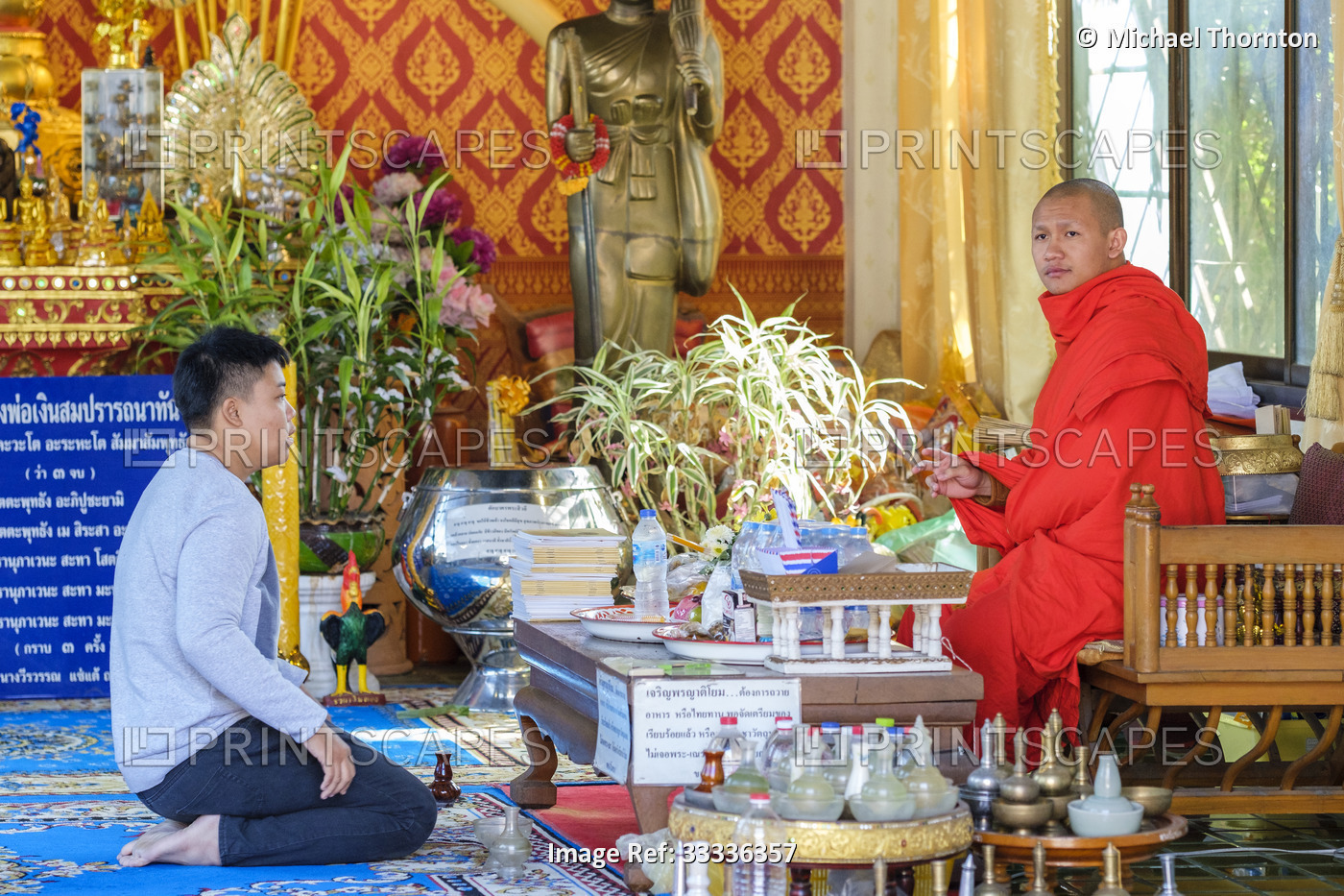 Prayers and Offerings with the local monk, Wat Inthakin Sadeu Muang, Chiang ...