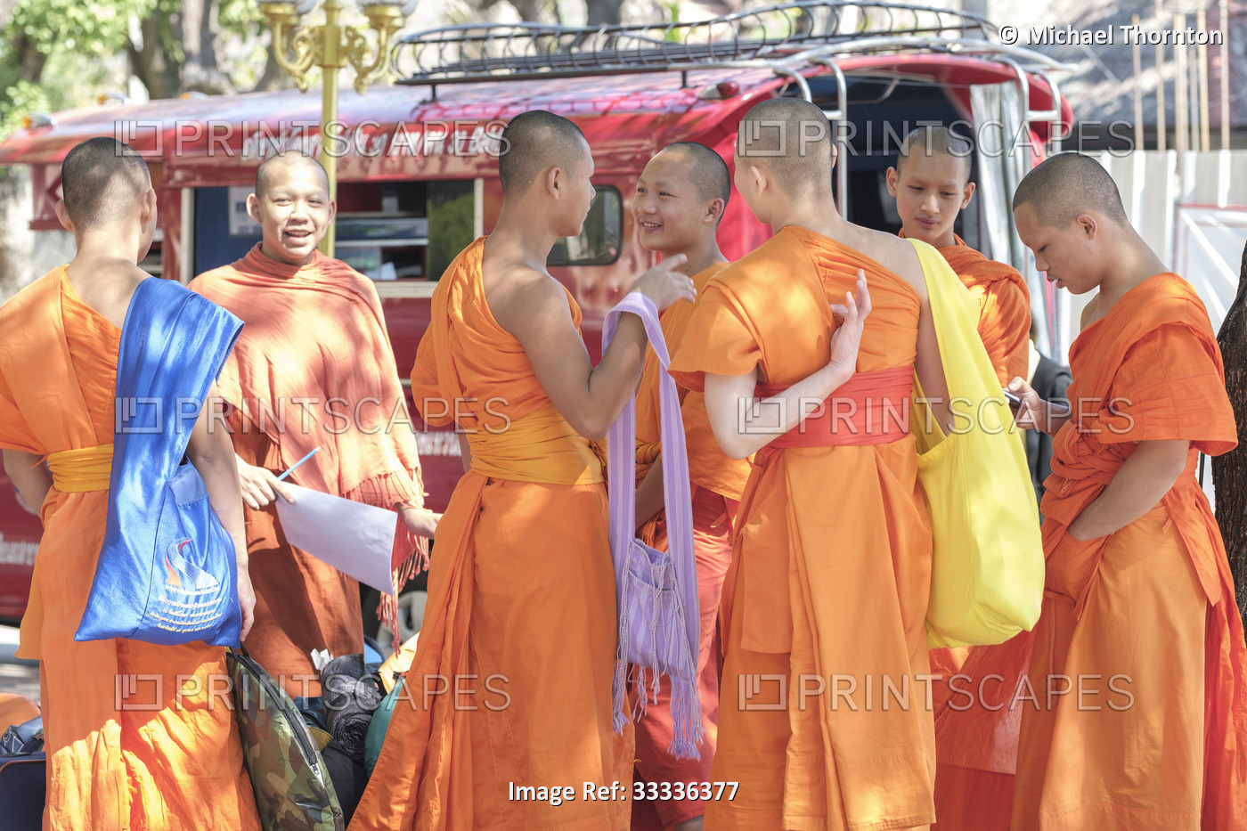 Young monks waiting for the bus, Wat Suandok, Chiang Mai, Thailand